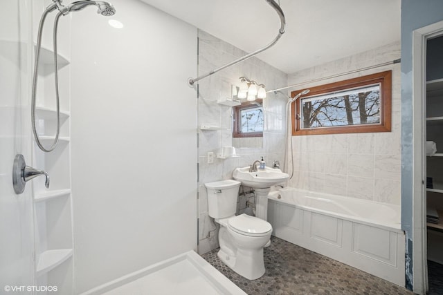127 Tilton Park Dr, Dekalb, IL 60115 - bathroom featuring tile walls, a washtub, a shower, and toilet