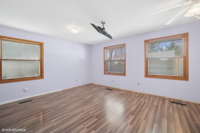 127 Tilton Park Dr, Dekalb, IL 60115 - spare room with a ceiling fan, wood finished floors, and visible vents