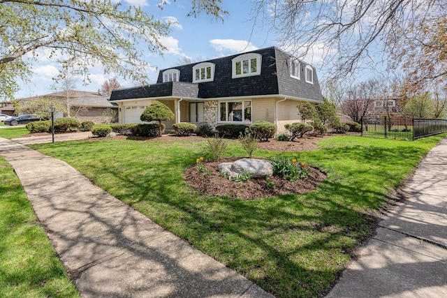 front facade with a shingled roof, mansard roof, an attached garage, fence, and brick siding