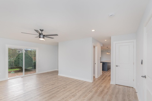 empty room featuring recessed lighting, baseboards, a ceiling fan, and light wood-style flooring