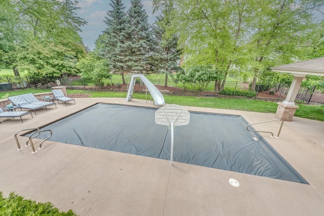 3908 Royal Portrush Dr, Naperville, IL 60564 - view of pool featuring a water slide, a patio, and view of wooded area