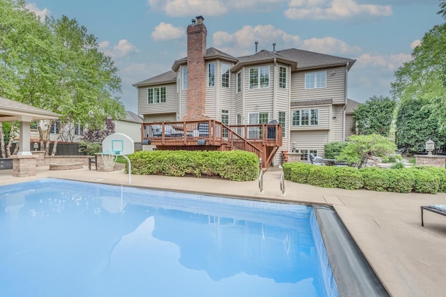 3908 Royal Portrush Dr, Naperville, IL 60564 - back of property featuring a deck, a chimney, an outdoor pool, and stairway