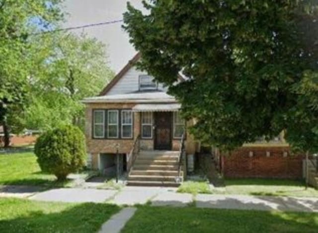 555 E 88th Pl, Chicago, IL 60619 - view of front of home featuring a front yard