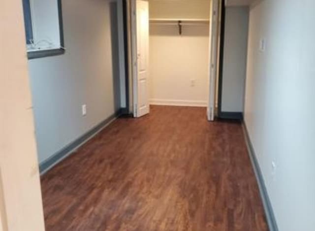 555 E 88th Pl, Chicago, IL 60619 - unfurnished bedroom with wood finished floors and baseboards
