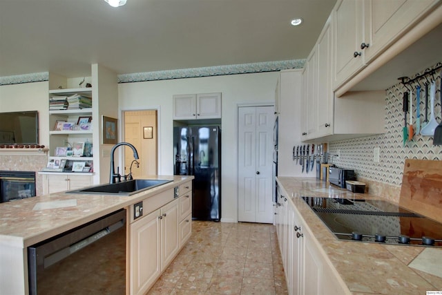 5620 Ridgeline Dr, Quincy, IL 62305 - kitchen with a sink, black appliances, tasteful backsplash, a center island with sink, and light tile patterned flooring
