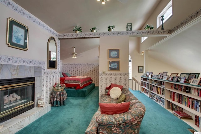 5620 Ridgeline Dr, Quincy, IL 62305 - living area with carpet flooring, a ceiling fan, wallpapered walls, wainscoting, and a tile fireplace