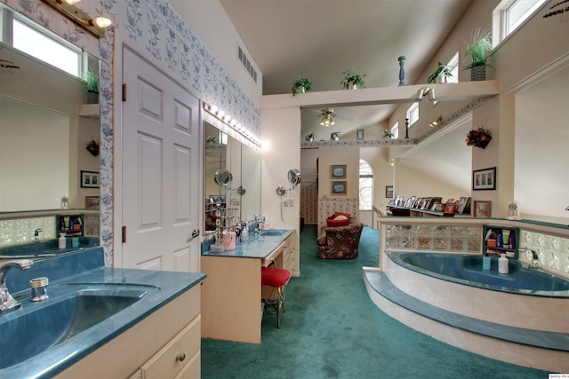 5620 Ridgeline Dr, Quincy, IL 62305 - full bathroom with ceiling fan, two vanities, a bath, and a high ceiling