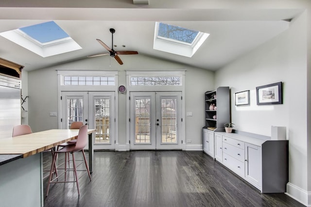 2642 N Drake Ave, Chicago, IL 60647 - interior space with vaulted ceiling with skylight, plenty of natural light, dark wood-style flooring, and french doors