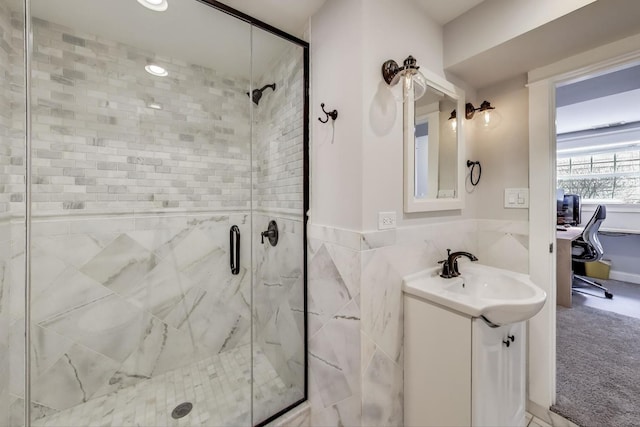 2642 N Drake Ave, Chicago, IL 60647 - bathroom featuring a shower stall, a wainscoted wall, and vanity