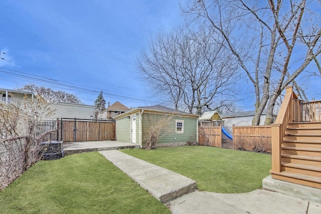 2642 N Drake Ave, Chicago, IL 60647 - view of yard with a fenced backyard, an outdoor structure, cooling unit, and a playground