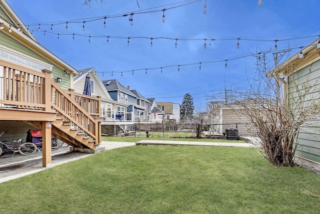 2642 N Drake Ave, Chicago, IL 60647 - view of yard with fence, a residential view, a deck, and stairway