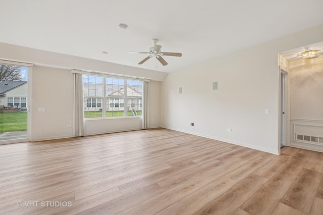 unfurnished living room with ceiling fan, visible vents, plenty of natural light, and light wood-type flooring