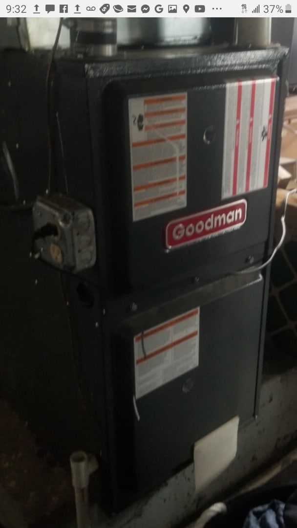 utility room featuring heating unit