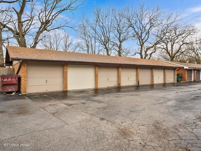 garage with fence