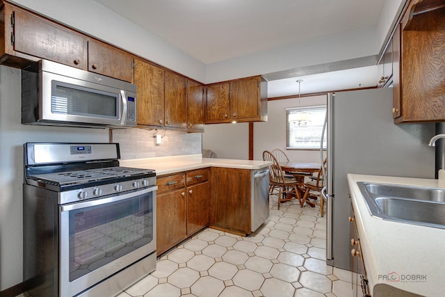 33170 N Battershall Rd, Grayslake, IL 60030 - kitchen featuring stainless steel appliances, light floors, light countertops, and brown cabinets