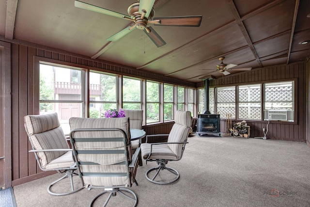 33170 N Battershall Rd, Grayslake, IL 60030 - sunroom with ceiling fan, a wood stove, plenty of natural light, wood walls, and lofted ceiling