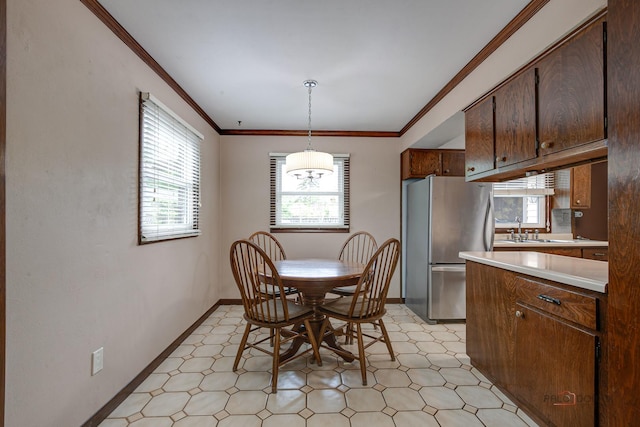 33170 N Battershall Rd, Grayslake, IL 60030 - dining room with light floors, healthy amount of natural light, baseboards, and ornamental molding