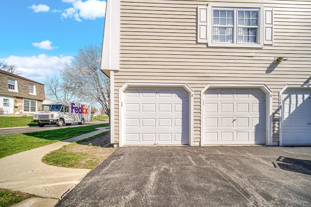 garage featuring driveway