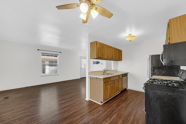 kitchen with stainless steel appliances, a ceiling fan, light countertops, and dark wood finished floors