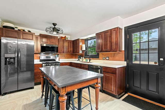 5802 Tennessee Ave, Clarendon Hills, IL 60514 - kitchen featuring stainless steel appliances, plenty of natural light, decorative backsplash, and a sink