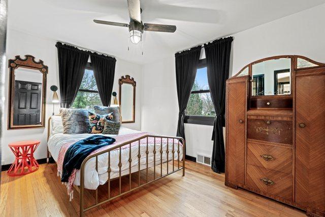 5802 Tennessee Ave, Clarendon Hills, IL 60514 - bedroom featuring visible vents, wood finished floors, and a ceiling fan