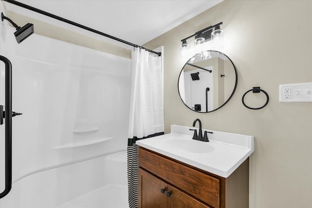 bathroom featuring a shower with curtain and vanity