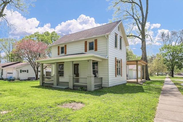 view of front of home with covered porch, a shingled roof, and a front lawn