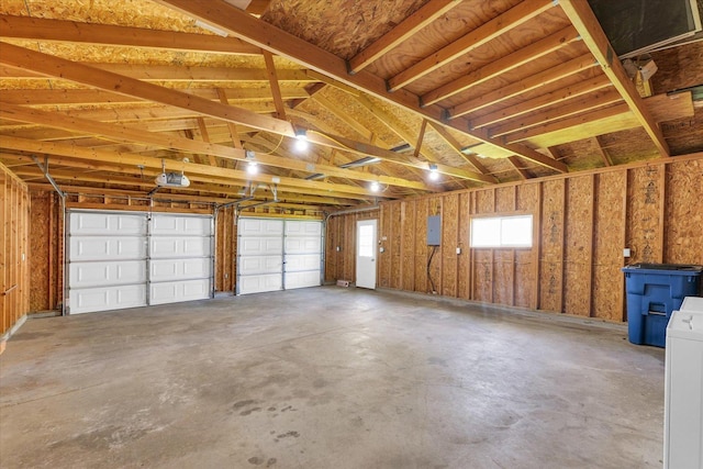 garage featuring washer / clothes dryer and a garage door opener