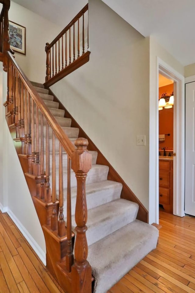406 Woodcroft Ln, Schaumburg, IL 60173 - staircase featuring hardwood / wood-style floors and baseboards