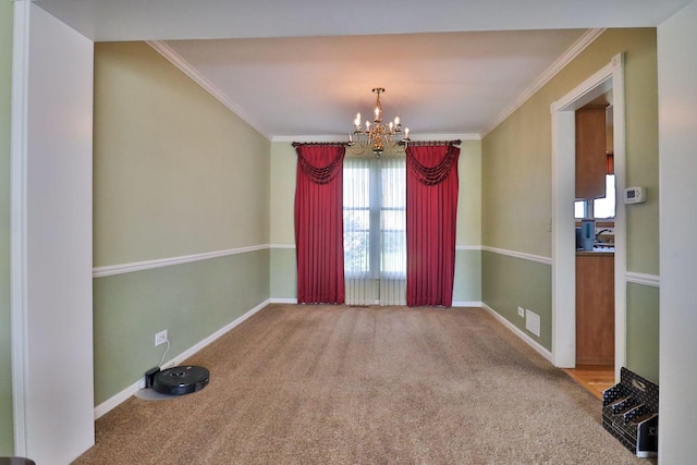 406 Woodcroft Ln, Schaumburg, IL 60173 - empty room with carpet flooring, crown molding, baseboards, and a notable chandelier