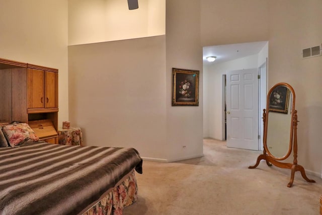 406 Woodcroft Ln, Schaumburg, IL 60173 - bedroom featuring baseboards, visible vents, a towering ceiling, and light colored carpet