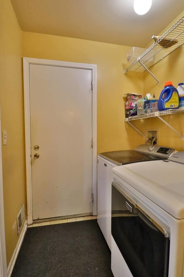 406 Woodcroft Ln, Schaumburg, IL 60173 - clothes washing area with visible vents, washer and dryer, and laundry area