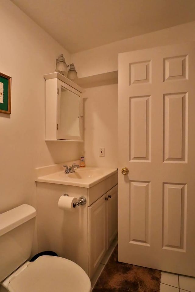 406 Woodcroft Ln, Schaumburg, IL 60173 - half bathroom with tile patterned flooring, toilet, and vanity