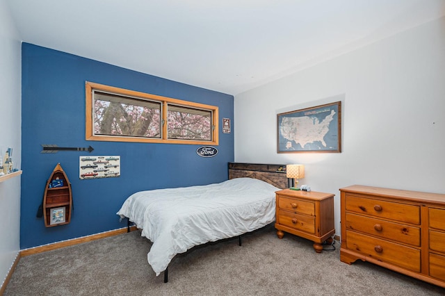 carpeted bedroom with baseboards