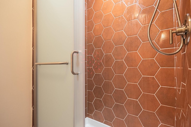 full bath featuring a shower stall