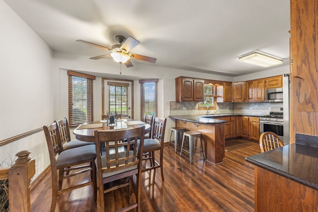 interior space featuring ceiling fan and dark wood-type flooring
