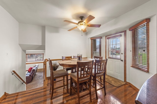 dining area featuring baseboards, a ceiling fan, and wood finished floors