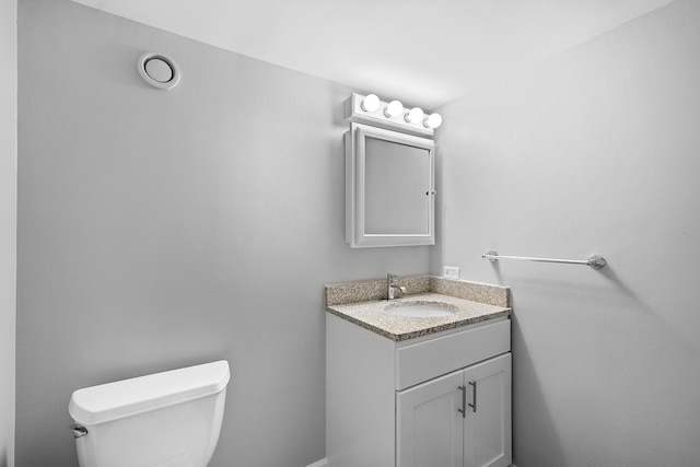 711 W Gordon Ter Unit 103, Chicago, IL 60613 - half bathroom featuring toilet and vanity