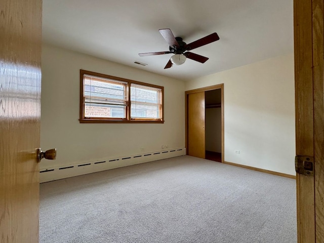 4941 N Kilpatrick Ave, Chicago, IL 60630 - unfurnished bedroom with carpet floors, a baseboard radiator, visible vents, and a closet