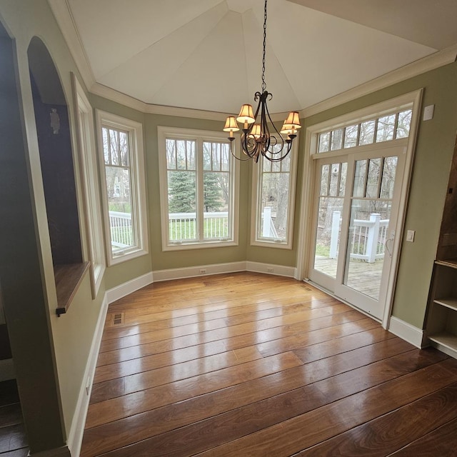 9065 Edinburgh Ct, Lakewood, IL 60014 - unfurnished dining area featuring baseboards, lofted ceiling, an inviting chandelier, ornamental molding, and hardwood / wood-style floors
