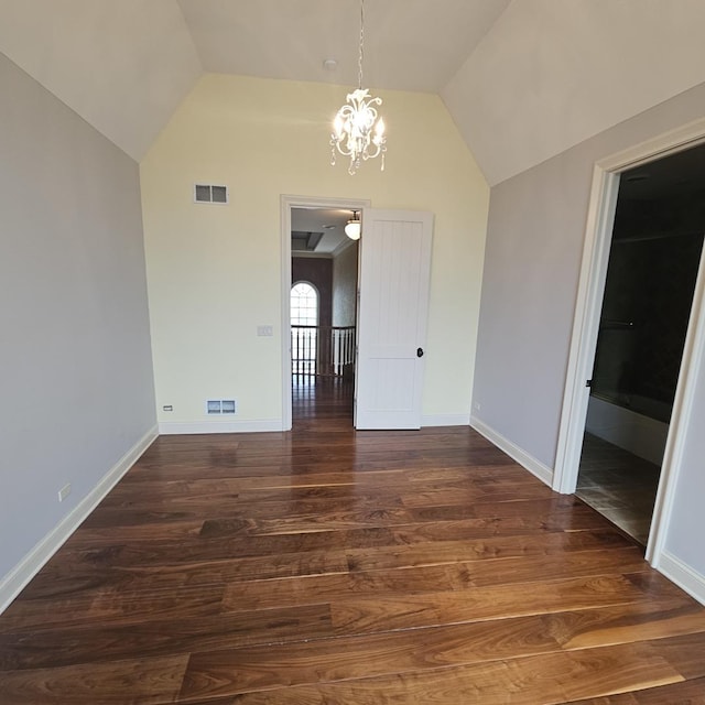9065 Edinburgh Ct, Lakewood, IL 60014 - unfurnished dining area featuring visible vents, dark wood-style flooring, vaulted ceiling, and an inviting chandelier
