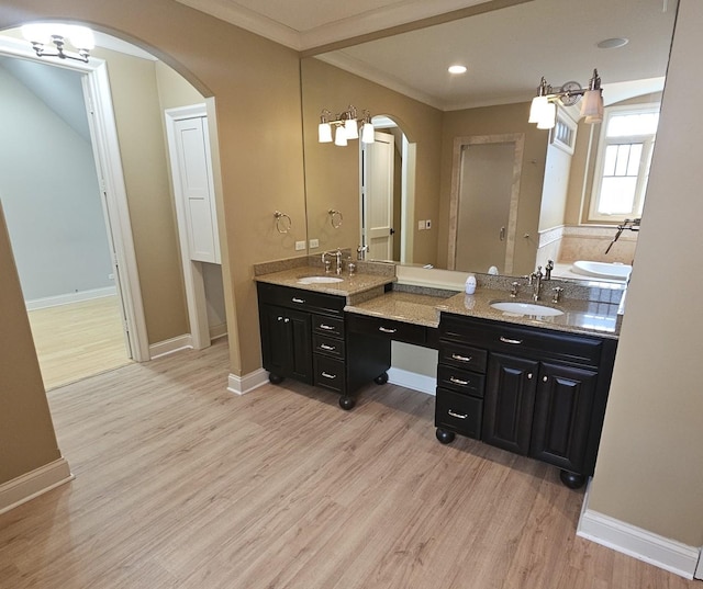 9065 Edinburgh Ct, Lakewood, IL 60014 - full bathroom with double vanity, a sink, and wood finished floors