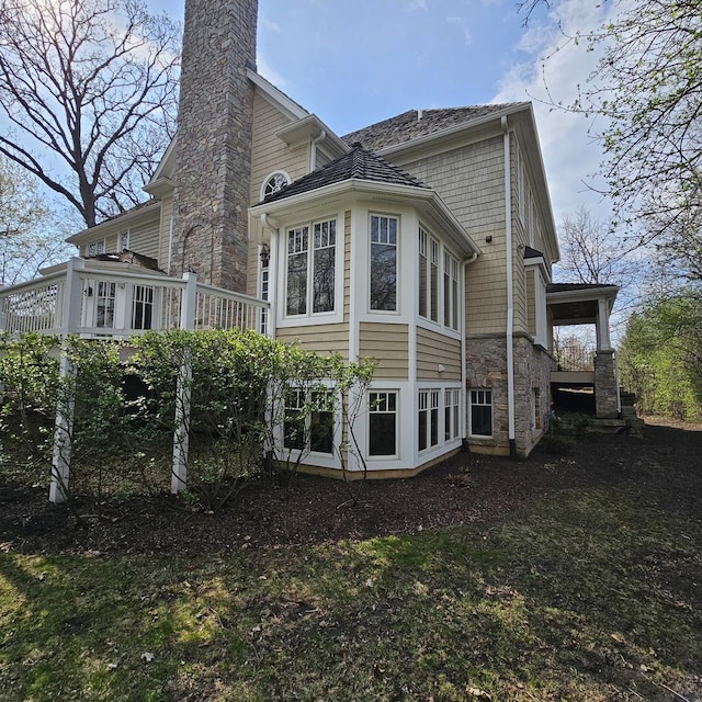 9065 Edinburgh Ct, Lakewood, IL 60014 - rear view of house featuring a chimney and a deck