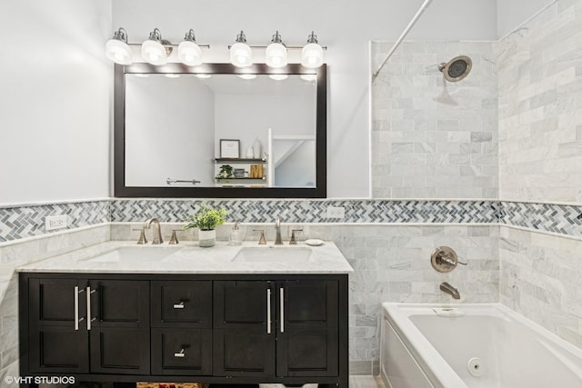 full bathroom featuring a sink, tile walls, a whirlpool tub, and double vanity
