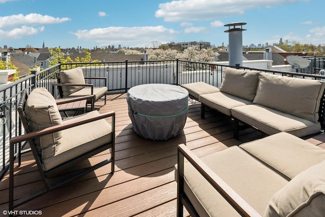 wooden terrace featuring outdoor lounge area