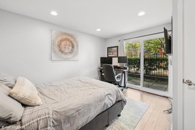 bedroom featuring access to outside, recessed lighting, wood finished floors, and visible vents