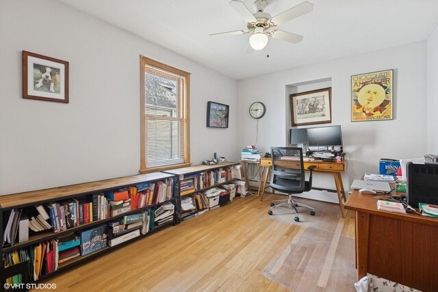 office area with wood finished floors and ceiling fan