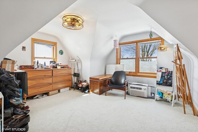 carpeted office with lofted ceiling