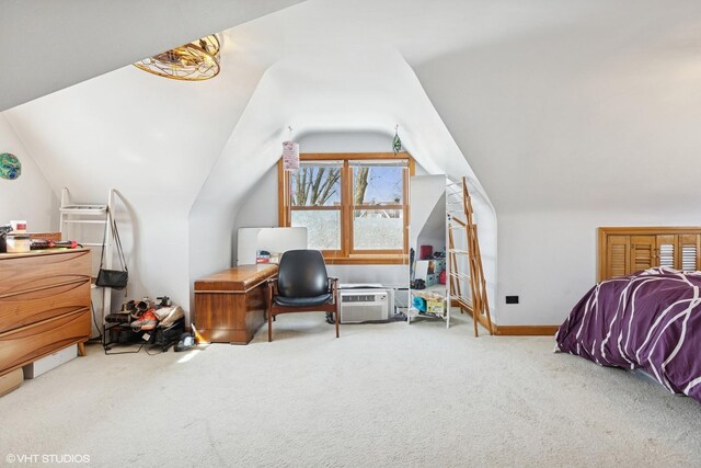 carpeted bedroom with lofted ceiling