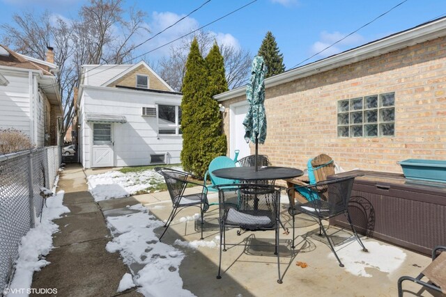 view of patio featuring fence and outdoor dining space
